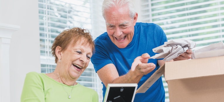 Older people packing moving boxes