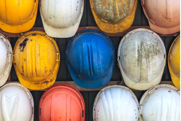 Construction hats hanging on wall